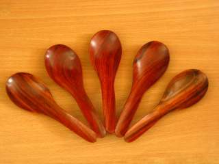   wooden spoon made of rose wood, natural wood grain. Real usage