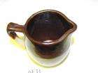   pottery syrup or cream pitcher size 5x3 5 condition notables i see