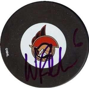  Wade Redden autographed Hockey Puck (Ottawa Senators 