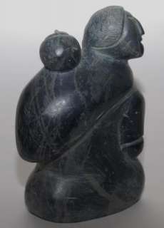 SIGNED INUIT WOMAN & CHILD IN CARVED MULTICOLORED SERPENTINE  
