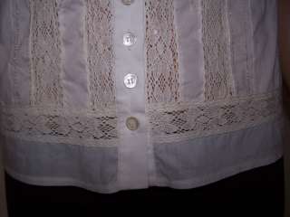 15.5 from center of neckline to bottom hem in front (down button 