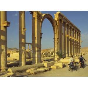 Two Cyclists Pass the Great Colonnade (Cardo), Palmyra, Unesco World 