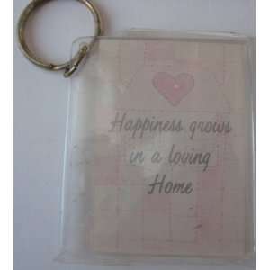  Happiness grows in a loving Home Keychain . You can also 