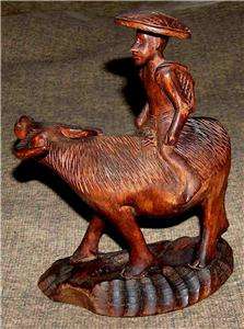 Handcarved Wooden Man Riding On An Ox  