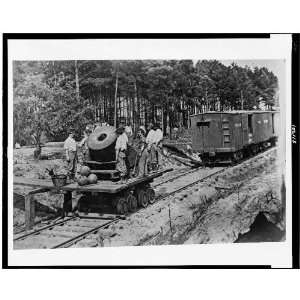  Soldiers with cannon on small railroad car