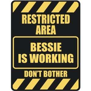   RESTRICTED AREA BESSIE IS WORKING  PARKING SIGN