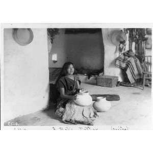  A Moki potter,Oraibe,Hopi woman on floor with pottery 