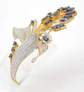 this is anamazing two tone 18k gold sparkling diamonds and blue