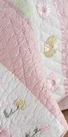 This set is a classic quilt horizontal stripe design with ribbon 