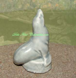   collection is this porcelain figurine depicting a Grey CIRCUS SEAL